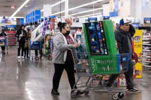 Shoppers pick up televisions and other Black Friday deals at a Wal-Mart on Nov. 25, 2022, in Dunwoody, Georgia. Walmart opened at 6am on Black Friday for shoppers with discounts on some high priced items. 