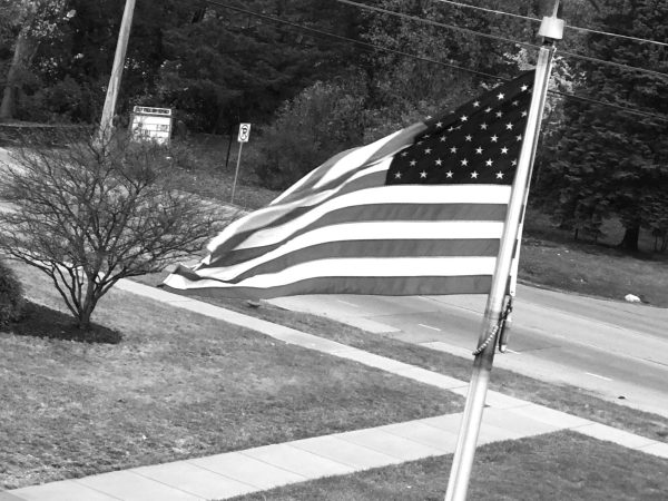 A flag hangs outside of the Upper Campus the day before the Election Day in the United States, a reminder of citizens' civic duty to cast their ballot for the President of the United States on Tuesday.