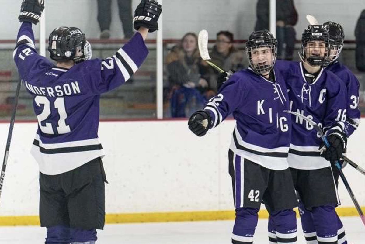 Players on the Kings High School Hockey team celebrate after scoring a goal last season. Many players on the team are from MCHS.