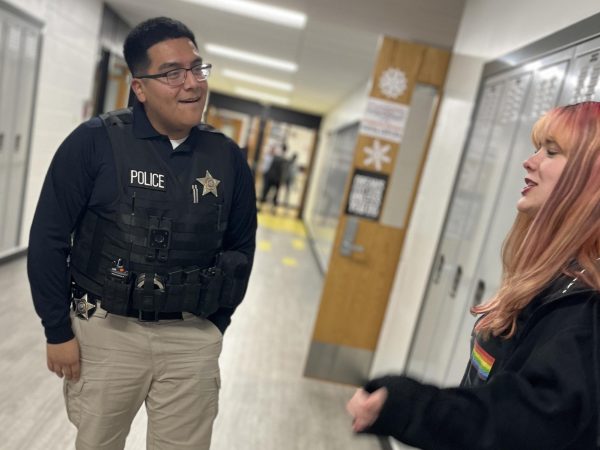 Officer Martinez talks to a student at the Freshman Campus on Jan. 27 during his routine patrol through the hallways during lunch periods.