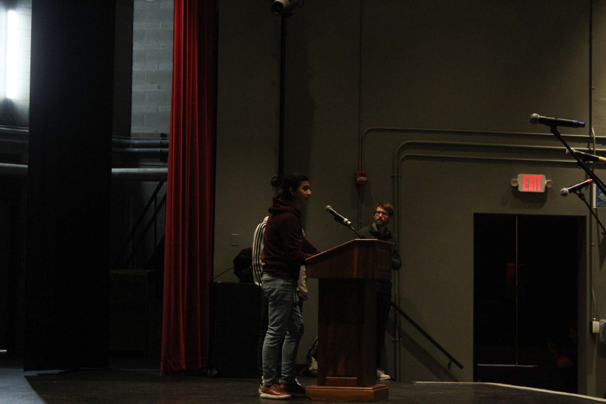 Sophomore students perform their deep, emotional poems in the auditorium to classmates and the judges during the Poetry Slam on Friday.