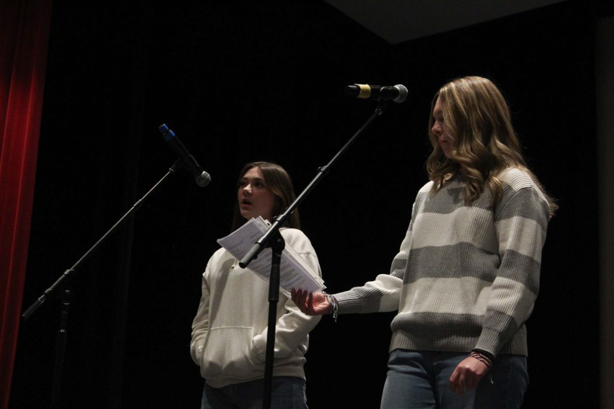 Sophomore students perform their deep, emotional poems in the auditorium to classmates and the judges during the Poetry Slam on Friday.