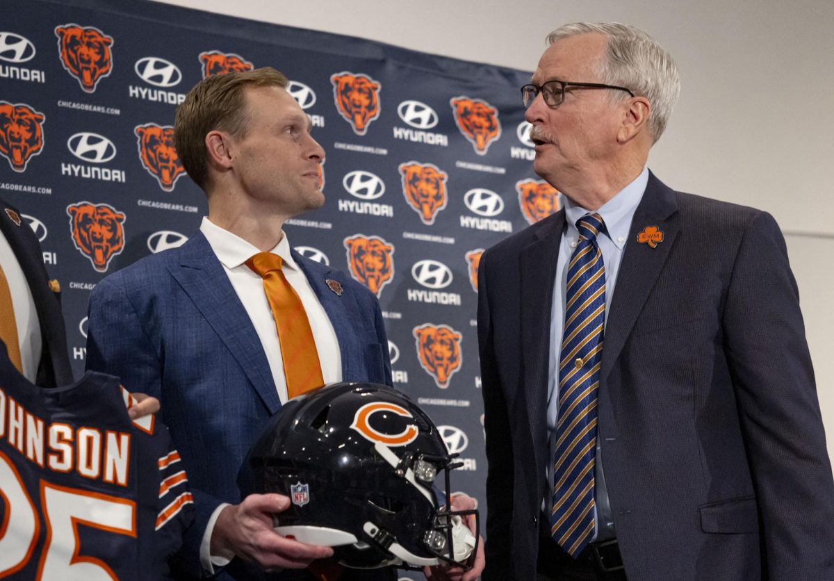 New Chicago Bears coach Ben Johnson, left, speaks with Chairman George McCaskey after being introduced at a news conference on Wednesday, Jan. 22, 2025, at Halas Hall in Lake Forest, Illinois. 