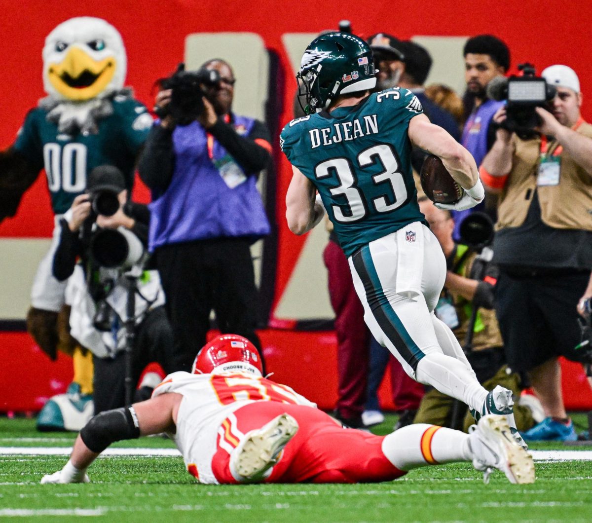 Kansas City Chiefs guard Mike Caliendo (66) falls flat while trying to stop Philadelphia Eagles cornerback Cooper DeJean (33) from running in an interception for a touchdown in the second quarter during Super Bowl LIX on Sunday, Feb. 9, 2025, in New Orleans.