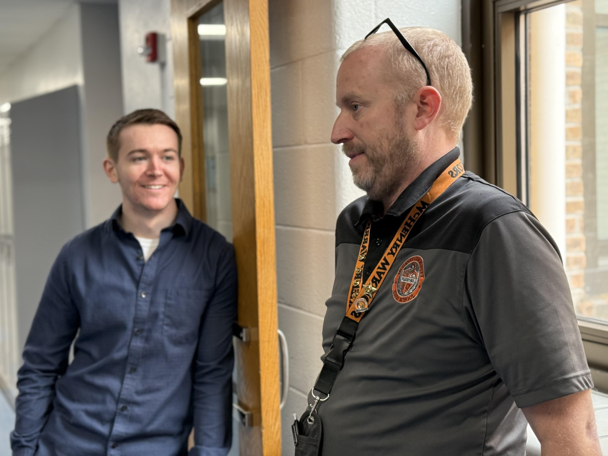 Freshman Campus principal Greg Eiserman talks to science and AVID teacher Max Zerdt in the hallway during fifth period on Tuesday hours after the district announced he will replace Dr. Jeff Prickett as Upper Campus principal during the next school year.