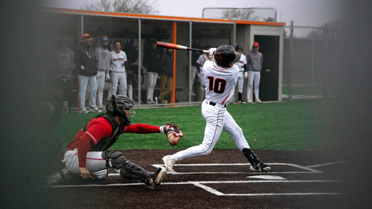 On April 1. MCHS varsity baseball team battles it out again Mundelein.