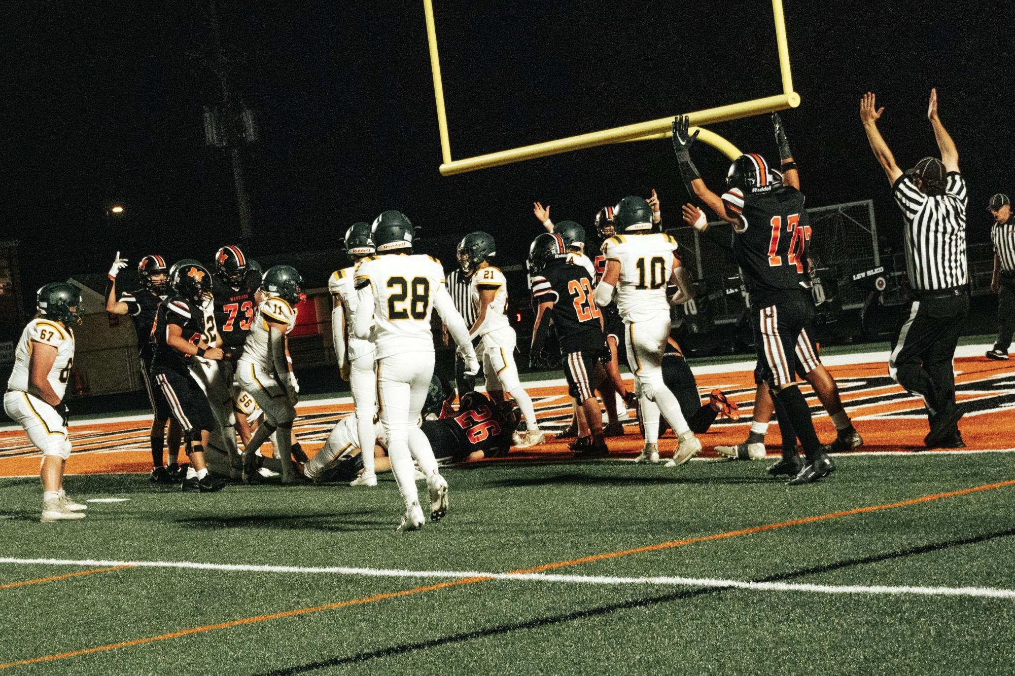 The varsity football team celebrates a touch down against Crystal Lake South on Sep. 4 at McCracken Field. The team has started their season with a 2-0 record.