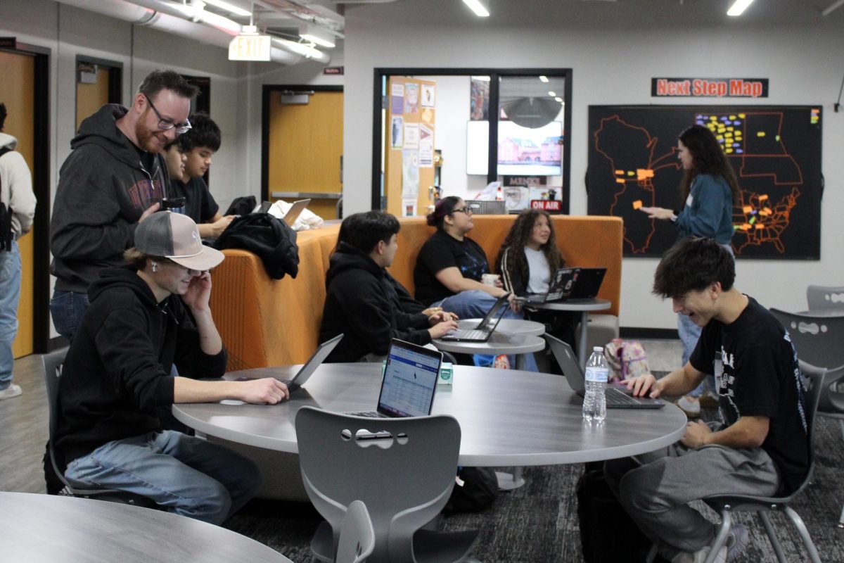 College and Career Counselor Curtis Menke works with students in the College and Career Center during AIM on Nov. 20. 