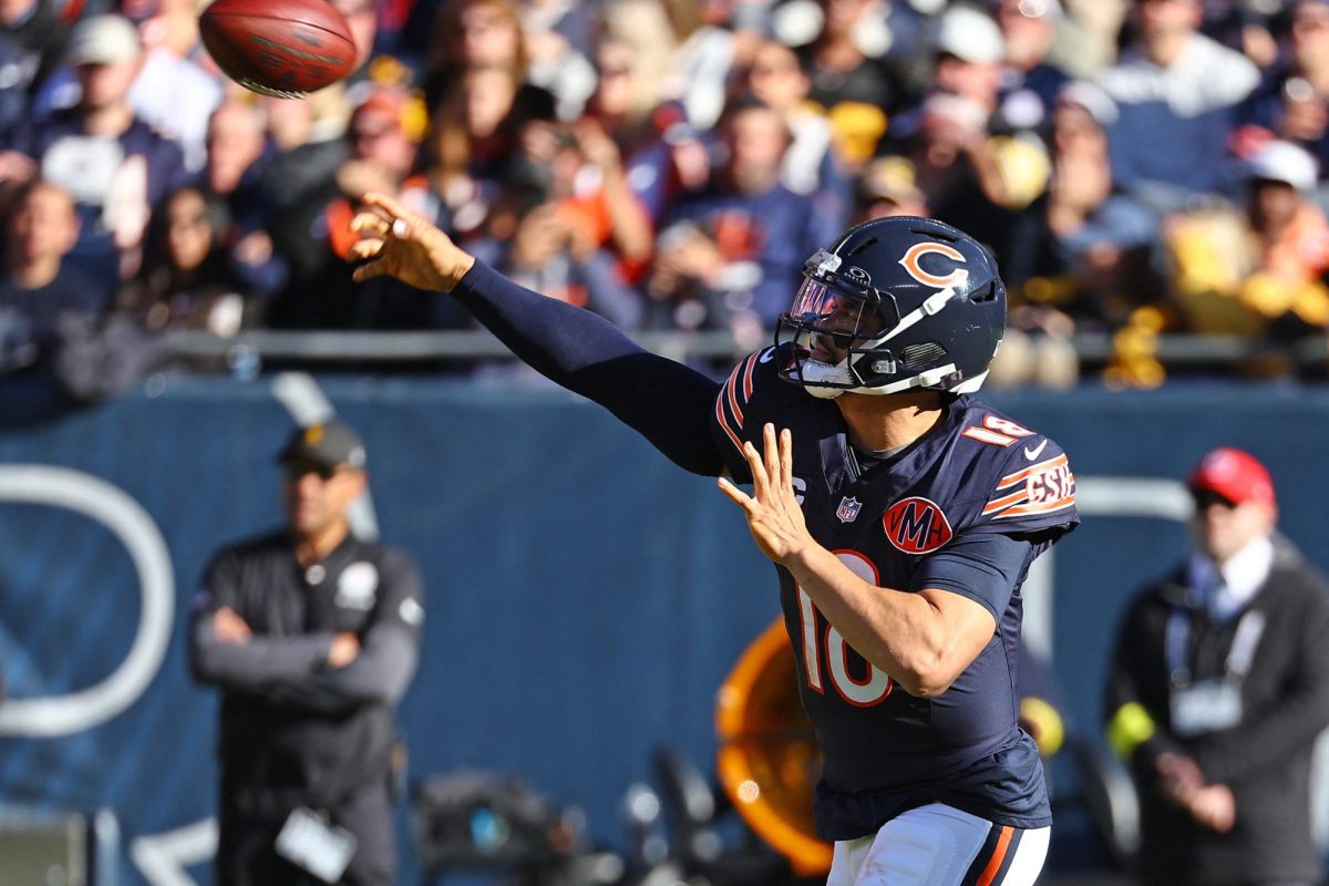 Nov 23, 2025; Chicago, Illinois, USA; Chicago Bears quarterback Caleb Williams (18) drops back to pass against the Pittsburgh Steelers during the second half at Soldier Field. Mike Dinovo-Imagn Images