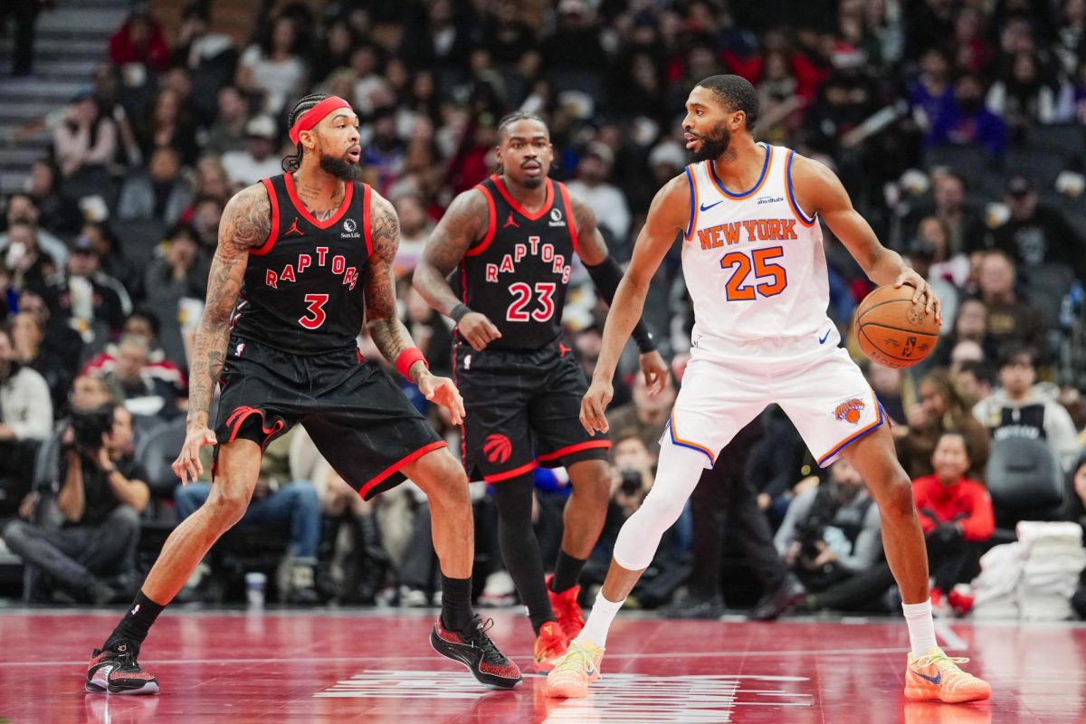 Dec 9, 2025; Toronto, Ontario, CAN; New York Knicks guard Mikal Bridges (25) handles the ball against Toronto Raptors forward Brandon Ingram (3) during the second half at the 2025-26 NBA Emirates Cup at Scotiabank Arena. Mandatory Credit: Kevin Sousa-Imagn Images