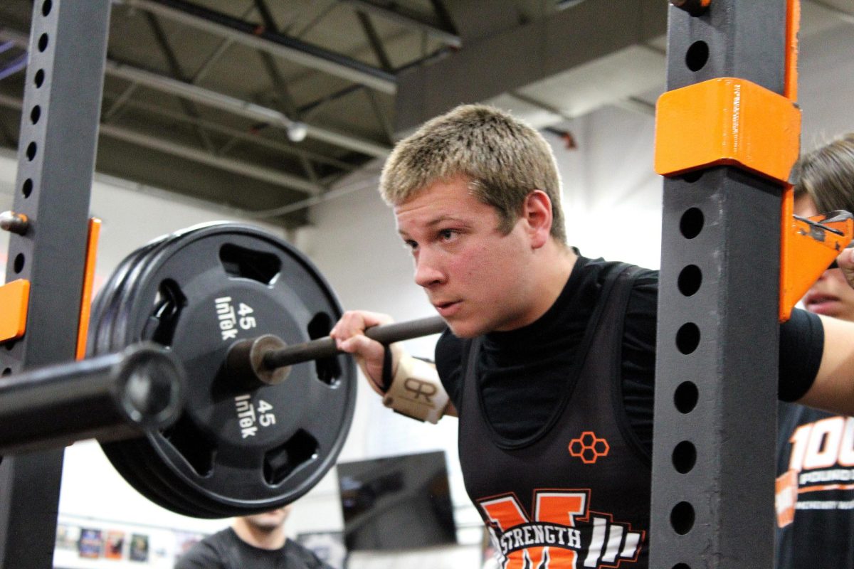 Students participate in Powerlifting's annual Liftmas competition, which took place on Dec. 10 in the Upper Campus weight room.