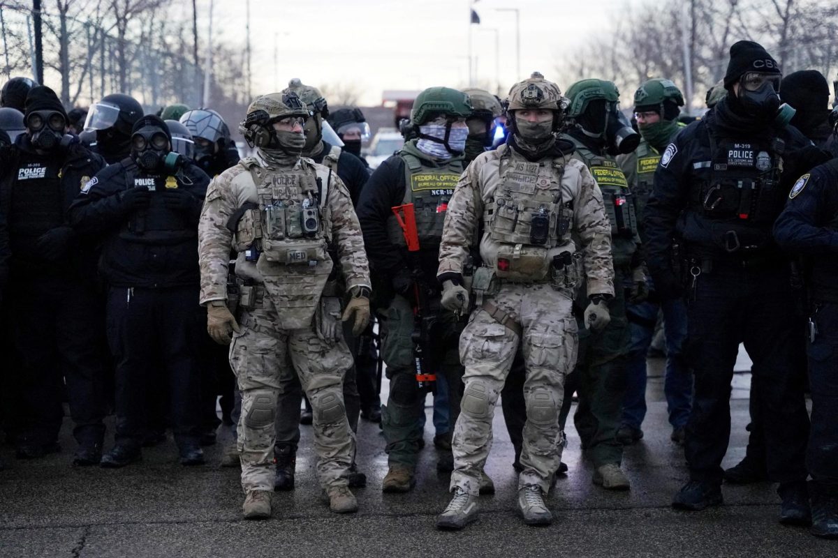 Members of U.S. Customs and Border Protection (CBP) and other law enforcement officials stand guard, in front of the Bishop Henry Whipple Federal Building, during a protest more than a week after an ICE agent fatally shot Renee Nicole Good, in Minneapolis, Minnesota, U.S., January 17, 2026. 