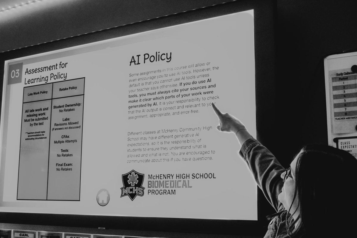Upper Campus BioMed teacher Leah Pelletier shows of her class’s AI policy, which creates space for students to use AI in the classroom. MCHS is fine-tuning a policy that would allow students to use AI more often.  
