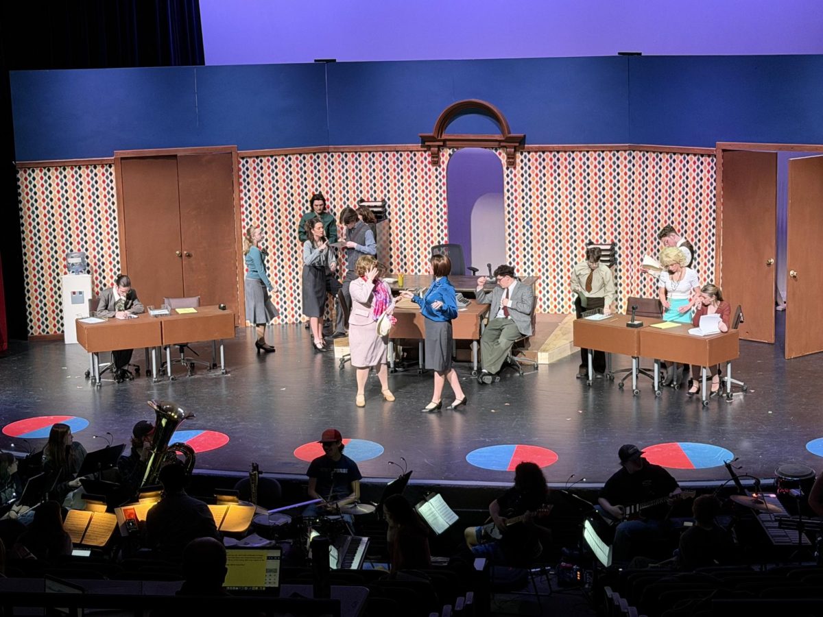 "9 to 5" cast and crew rehearses for opening night on March 11 in the Upper Campus Auditorium.