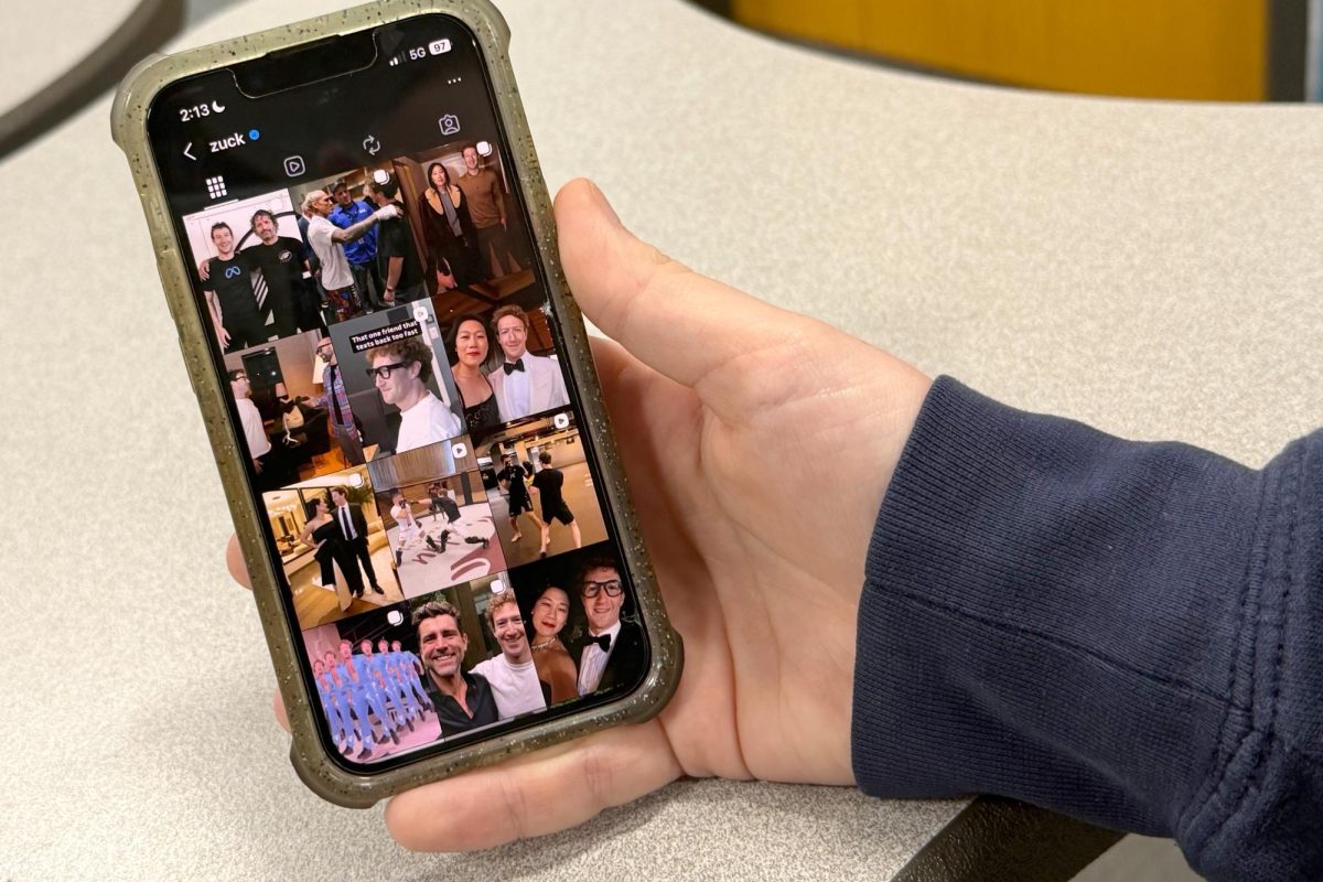 A student looks at Facebook CEO Mark Zukerburg's Instagram page after finding out about him being sued for his apps being designed to be addicting. Conversations in the U.S. Senate have caused schools to question how social media affects students and whether new rules should be put in place.