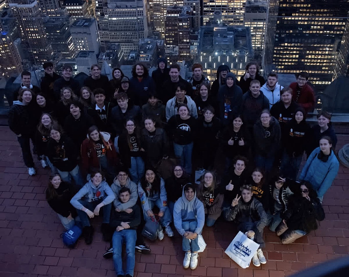 MCHS's band poses for a group photo at the "Top of the Rock" after taking in all the views and walking around Times Square.