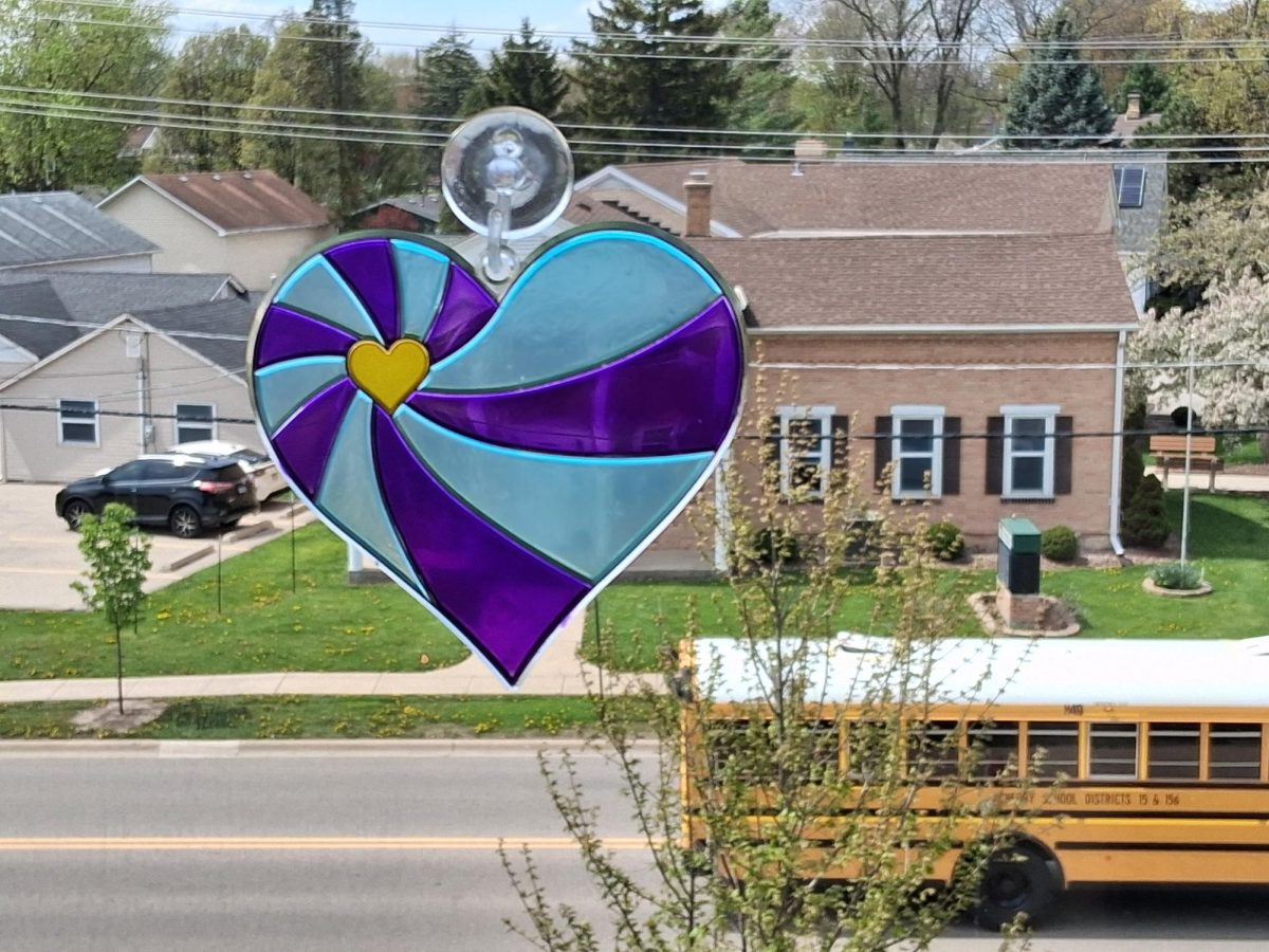A suncatcher hangs in a window in a Freshman Campus windows on April 28. Freshman students were invited to paint suncatchers to honor lost loved ones.