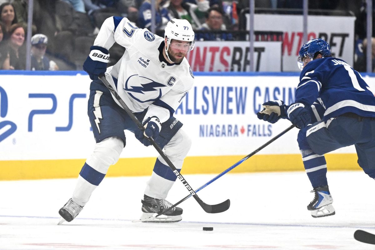 Mar 7, 2026; Toronto, Ontario, CAN;  Tampa Bay Lightning defenseman Victor Hedman (77) takes the puck away from Toronto Maple Leafs forward Calle Jarnkrok (19) in the second period at Scotiabank Arena. Fans were upset when Hedman announced he was stepping back for mental health reasons.