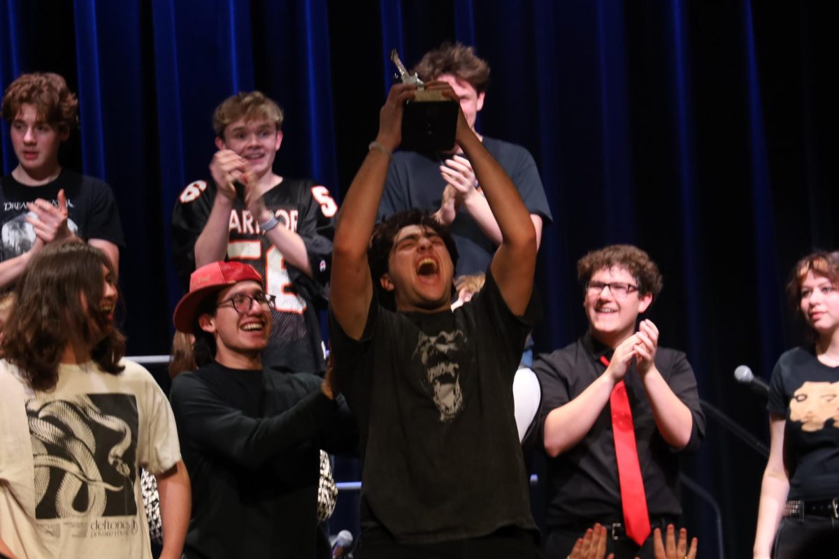 Ayden Hirsch (lead singer of Tone Deaf) celebrating their Battle of the Bands win. 